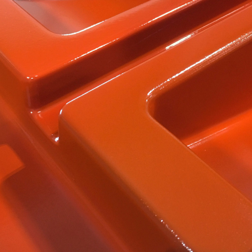 orange tooling gelcoat sprayed on plug surface 