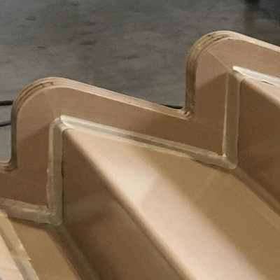 teflon peel ply over laminate placed in the mold will make for a finished rebate in the part